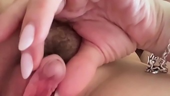 Beautiful woman pleases her friend’s sensitive area while she enjoys breast worship.